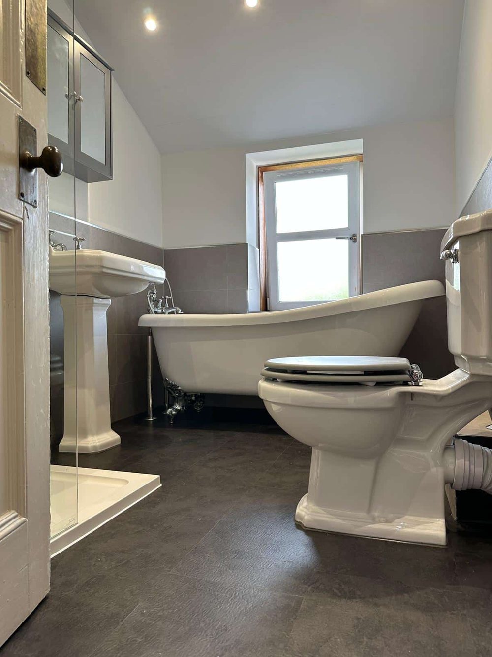 Roll top bath and pedestal basin in a period bathroom