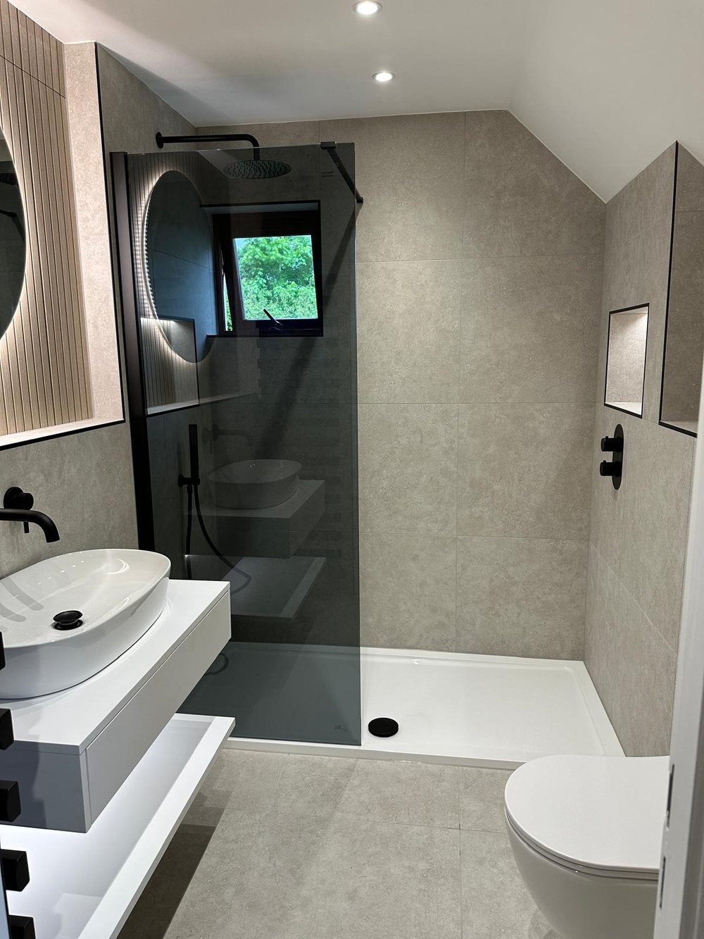 Wet room with a smoked glass screen and vessel basin
