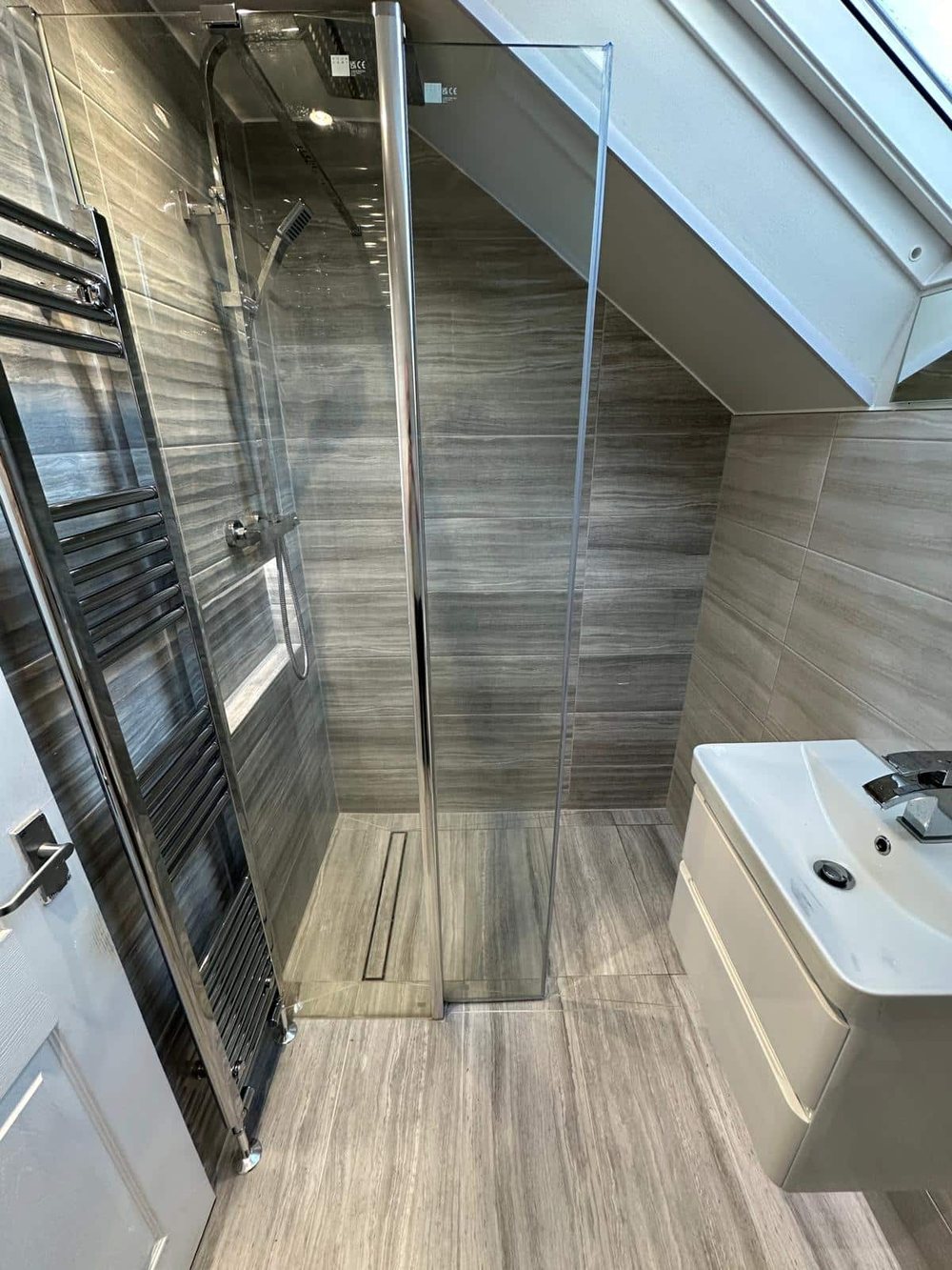 Wet room with wood effect wall tiles